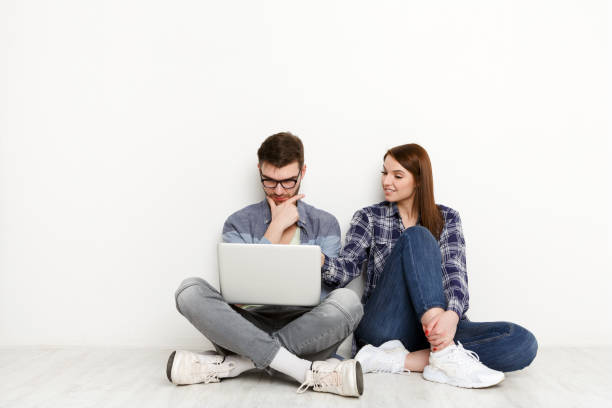 Team work at home, couple with laptop