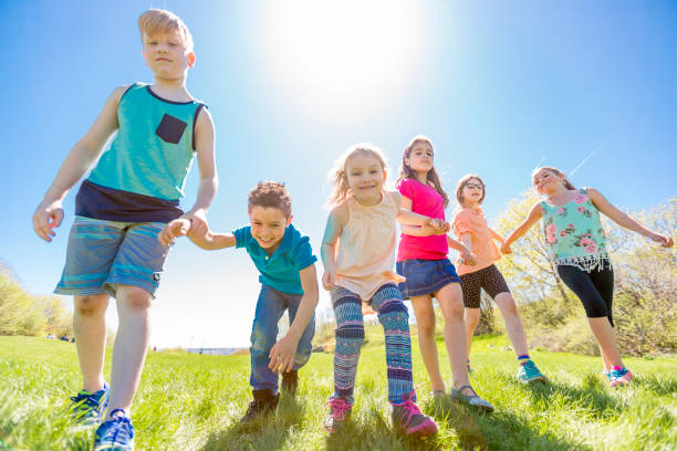 istock Group of child have fun on a field 850913828