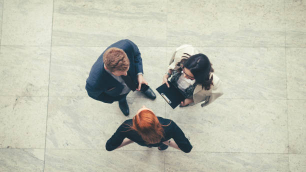 istock Business people in the lobby talking overhead shot 850914338