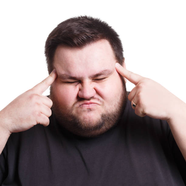istock Man suffering from headache, isolated shot 850915488