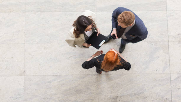 istock Business people talking overhead shot 850915564