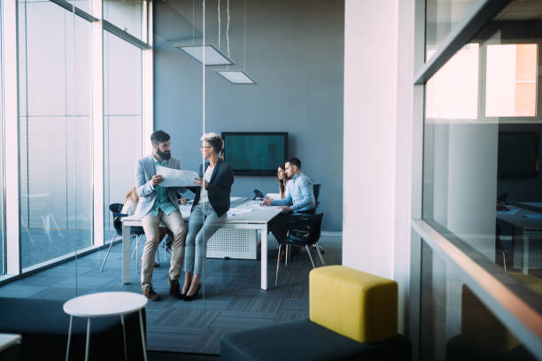 istock Young designers talking on break about business plans 850921180