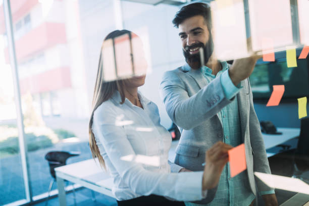 istock Picture of designers sticking notes in office 850923276