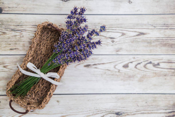 istock Lavender in wicker basket on wooden background 850925352
