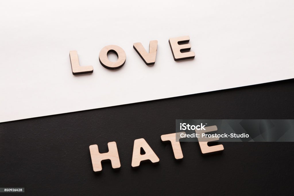 Words Love and Hate on contrast background Words Love and Hate on contrast background. Opposite feelings, strong emotions concept Furious Stock Photo