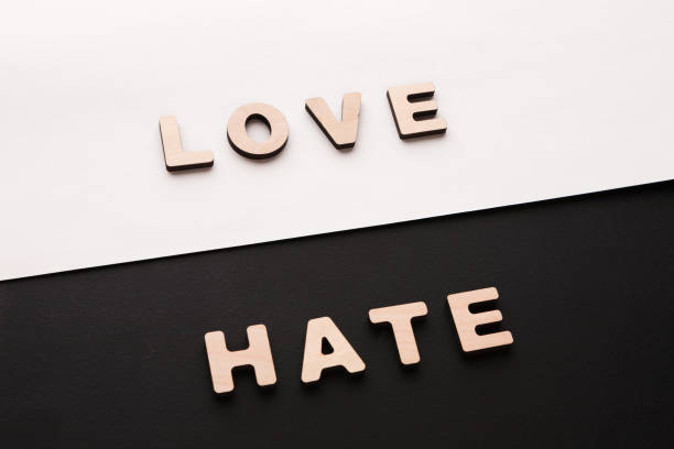 words love and hate on contrast background - single word love wood typescript imagens e fotografias de stock