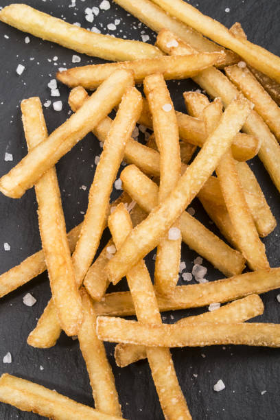 istock french fries with coarse salt on slate 850927946