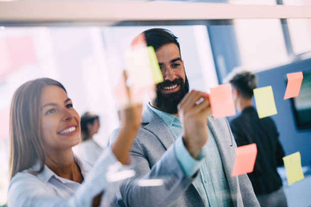 istock Picture of designers sticking notes in office 850935324