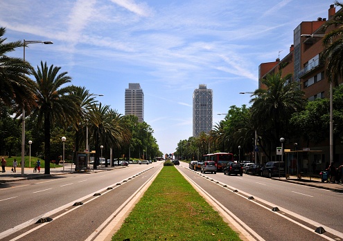 Barcelona, Catalonia, Spain, June 10, 2012: view along Carrer de la Marina - Mapfre Tower and Arts Hotel - photo by M.Torres