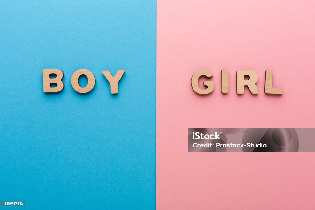 Words Boy and Girl on bright backgrounds Words Boy and Girl on bright backgrounds. Unknown baby gender, uncertainty and doubt concept Baby Boys Stock Photo