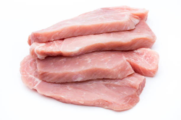 istock Fresh pork fillet with basil on a white background. 850941072