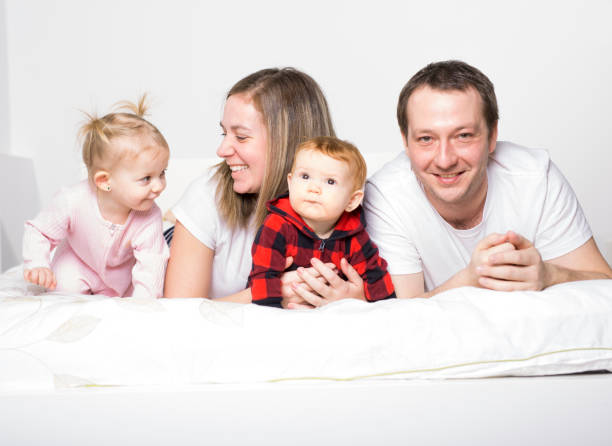 istock family from four people cheerfully spends time for beds 850941480