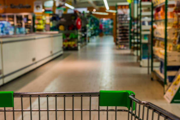 istock View from shopping trolley into abstract blurred supermarket aisle background 850941608