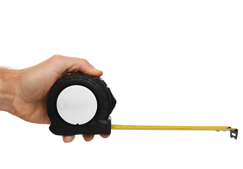 hand holding a tape measure isolated on a white background