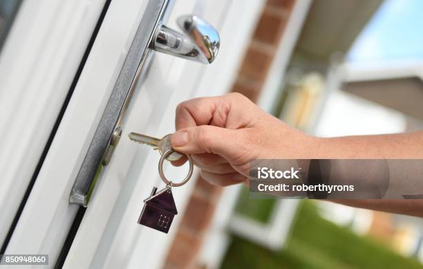 Opening A Door To House With Key Stock Photo - Download Image Now - Key, Lock, Door