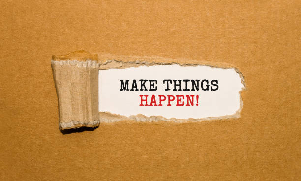 istock The text Make things happen appearing behind torn brown paper 850948614