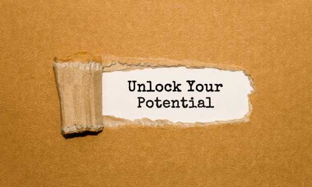 istock The text Unlock Your Potential appearing behind torn brown paper 850960510
