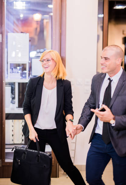 istock Young elegant couple going shopping 850960608