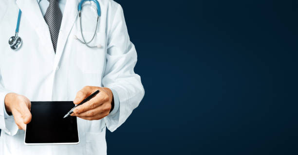 istock Male Doctor With Stethoscope Pointing Your Prescription Text On Digital Tablet Screen 850968650