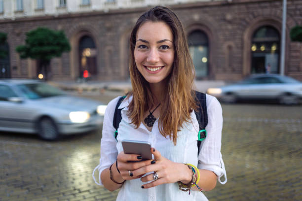 istock Female texting on the phone on the street 850970512