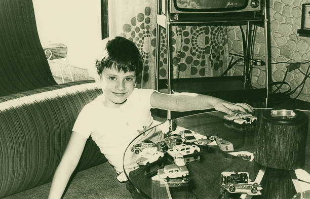 istock Vintage boy playing with toy cars 850975324