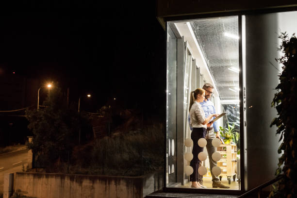 istock Businesspeople in the office at night working late. 850975476