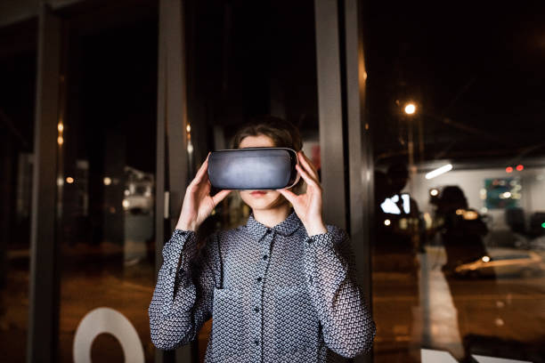 istock Businesswoman in the office wearing virtual reality goggles. 850977922