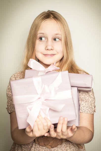 istock Surprised girl with gift box in her hands 850978294