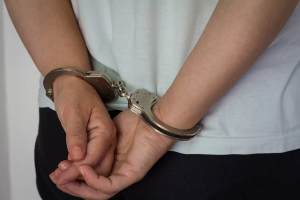 istock Women criminal in handcuffs arrested for crimes 850979512