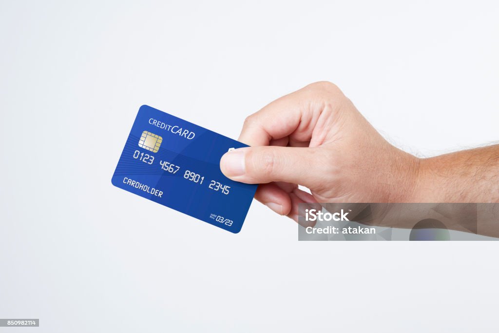 Man holding blue credit card Credit Card Stock Photo