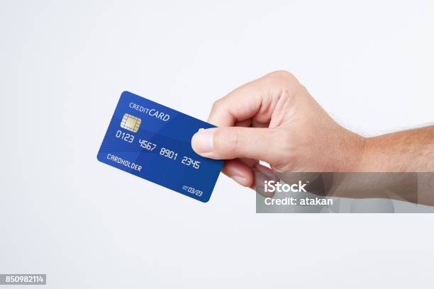 Man Holding Blue Credit Card Stock Photo - Download Image Now - Credit Card, Greeting Card, Holding