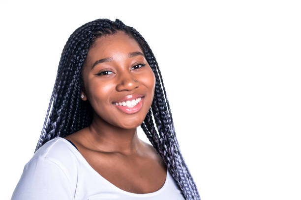 Beautiful young african woman posing isolated over white