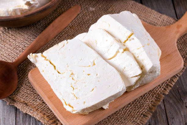 istock A piece of fresh rustic cottage cheese on a cutting board 850986818