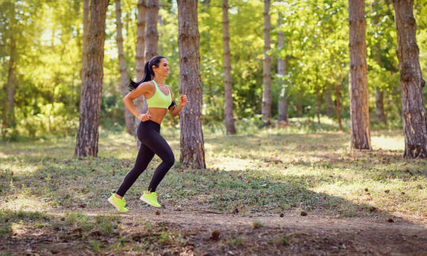istock A woman runs through the forest in a jog. 850986884