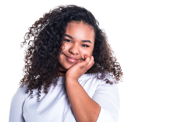 istock Beautiful young african woman posing isolated over white 850987512
