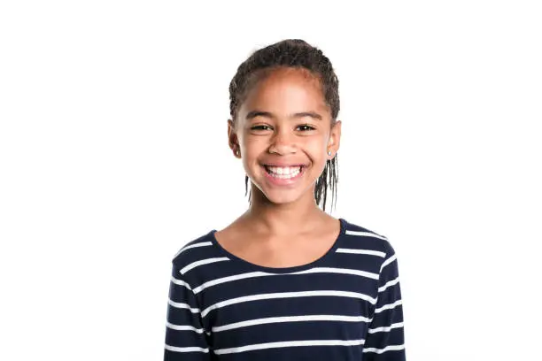 An Adorable african little girl on studio white background