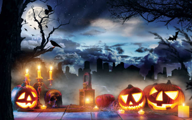 istock Spooky halloween pumpkins on wooden planks 850990380