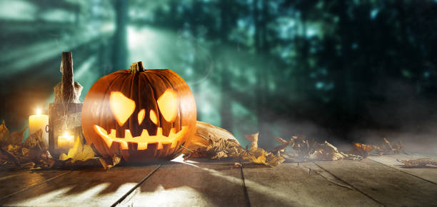 istock Spooky halloween pumpkins on wooden planks 850991018