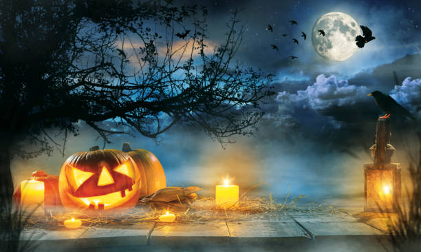 istock Spooky halloween pumpkins on wooden planks 850991314