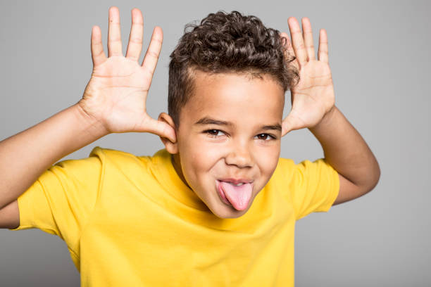 istock Adorable african boy on studio gray background 850994454