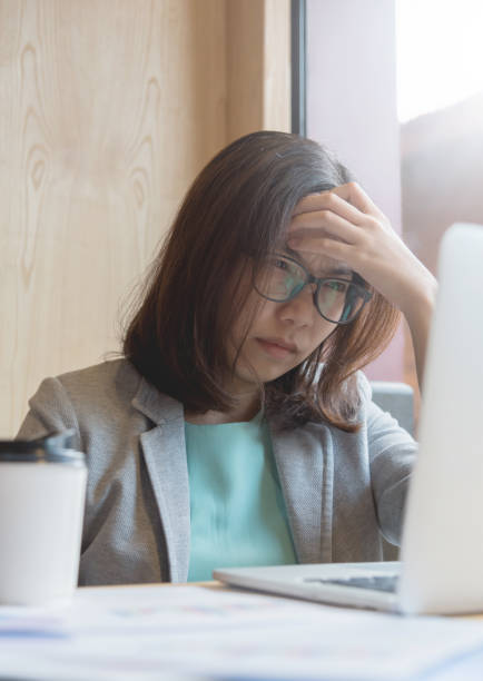 istock Business woman having headache from overtime working. 850994922