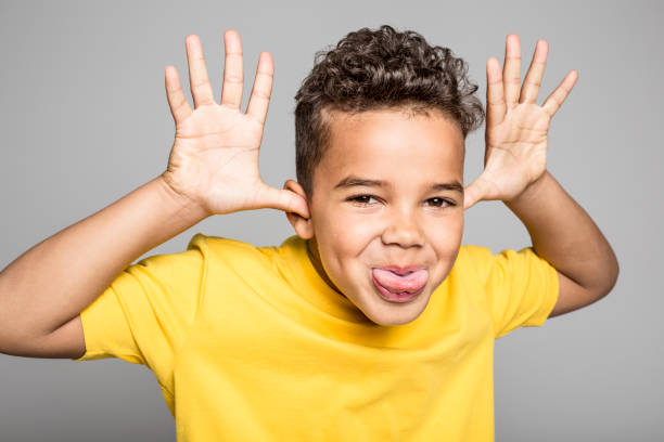 Adorable african boy on studio gray background