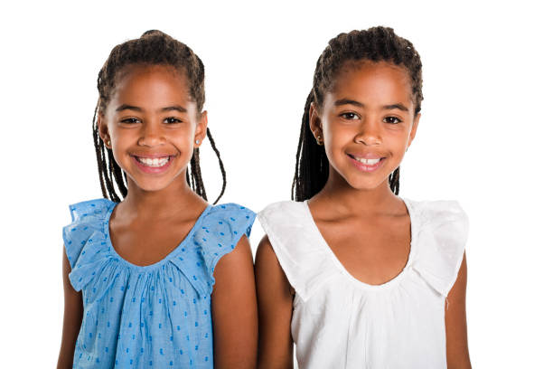 istock Two Adorable african twin girl on studio white background 850996454