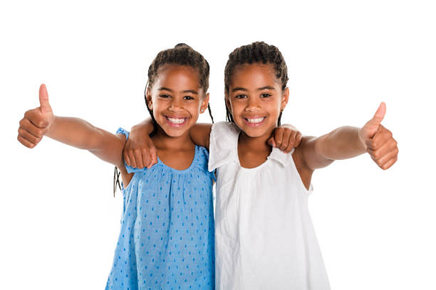 istock Two Adorable african twin girl on studio white background 850996666