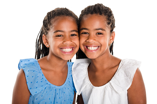 Adorable african twin girl on studio white background
