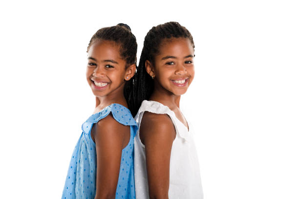 istock Two Adorable african twin girl on studio white background 850996960