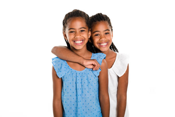 istock Two Adorable african twin girl on studio white background 850997210