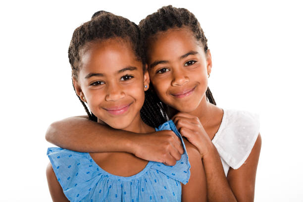 istock Two Adorable african twin girl on studio white background 850997410