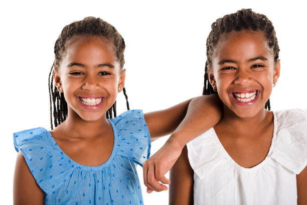 istock Two Adorable african twin girl on studio white background 850999956
