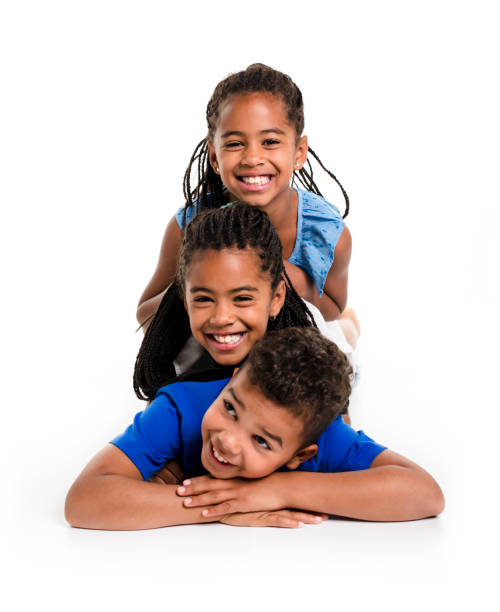 istock portrait of happy three black childrens, white background 851001752